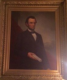 This is a painting of Abraham Lincoln, done by William Cogswell, displayed in the Mabel Tainter Theater