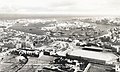 Air view of Marsamuscetto Harbour, Malta, with the Empire Sports Ground in the foreground, ca. 1950