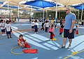 Airman, soldiers share in "Sports Day" with local children 140204-Z-QD538-216.jpg