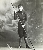 Mountain guide Alice Manfield with a long wooden walking pole in the early 1900s Alice Manfield - Guide Alice, Mt Buffalo, c1900-30, SLV.jpg
