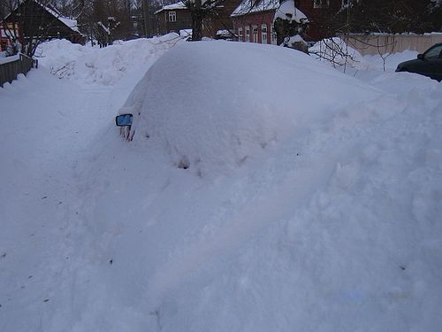 Car at the mercy of wild nature – snow and children