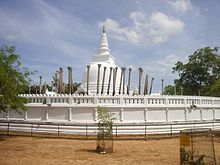 Stone pillars around the Stupa suggest that a Vatadage with a conical roof once sheltered the Stupa at the center of the covered space Anuradhapura25.jpg