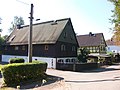 Cottage property consisting of residential house, side building and remnants of the paving