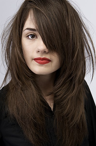 Brunette is the French term for a woman with brown (brun) hair.