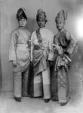 Three men in ceremonial dress