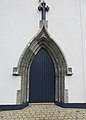 Main entrance of the Church of the Holy Rosary in Doolin. Note the stonework around the door, showing that the church is way older than its modern looks