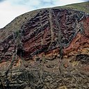 Cliff of Volcanic Rocks on Porto Santo island Madeira - Panoramio 66224938.jpg