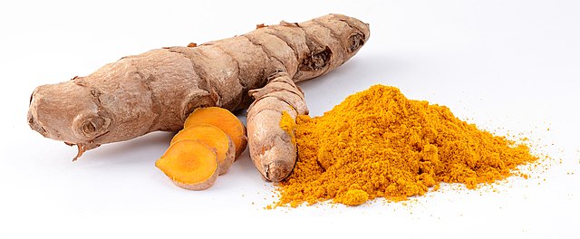 Turmeric rhizome, whole and ground into a spice