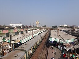 Dum Dum metro station (left) and railway station (right) Dumdum railway station in Sealda section 2.jpg