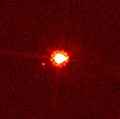 Der Zwergplanet Eris. Weiter links unten, nahe bei Eris, sein Satelliten Dysnomia.