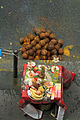 * Nomination Coconuts and altar in front of a shop, for Ganesh Chaturthi, Paris. --Coyau 02:39, 6 September 2011 (UTC) * Withdrawn Pas mal, sauf la composition. Trop de route, alors qu'il manque un bout de la nappe. La ligne du trottoir devrait être horizontale, plutôt... Non ?--Jebulon 14:15, 6 September 2011 (UTC) I's part of a sequence where all interesting things happend to the coconuts. --Coyau 15:26, 6 September 2011 (UTC)  I withdraw my nomination I can't re-shoot it. --Coyau 15:36, 7 September 2011 (UTC)