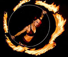 A hooper performing with a fire hula hoop in New York City Fire Gypsy performing with a fire hula hoop.jpg
