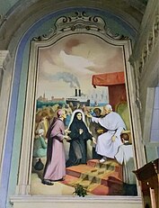 Le fresque de mère Cabrini, à l'entrée à droite.