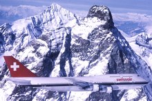 A 747-300, with its stretched upper deck, flying-by the Matterhorn. This 747-300 was first delivered to Swissair on March 23, 1983.