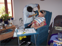 Geriatric patient receiving dental care.png