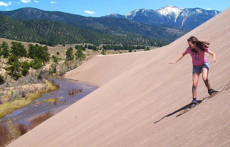 File:Girl Sandboarding Above Medano Creek, Castle Creek Picnic Area (23076291176).jpg