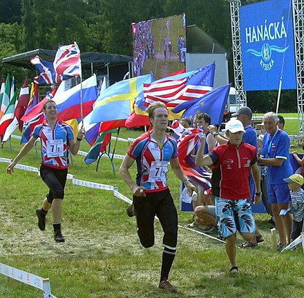 Foot-O relay, the winner crosses the line – joined by the rest of his team
