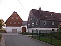 Side building of a four-sided courtyard