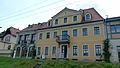 Former  Manor house with extension, studio house and side building