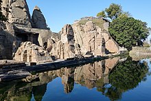 Damaged right-hand section, with reflection in the sacred pool. Masroor-Kangra-Himachal-R16 02699.jpg
