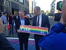 Mayor Ed Murray (left) and Seattle Department of Transportation director Scott Kubly (right) holding a rainbow-colored sign for Pike Street at the unveiling of the rainbow crossings in 2015 Mayor Ed Murray (left) & SDOT Director Scott Kubly (right) (19084604855).jpg