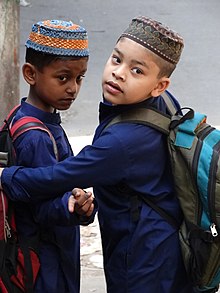 Bengali schoolboys in the port city of Chittagong. Muslim Schoolboys - Chittagong - Bangladesh (13058130525).jpg