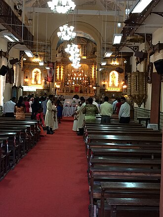 The church interior, showing the main and side altars and the pulpit that came from the Oratorian Convent of Cruz dos Milagros at Old Goa.Socorro, Goa Our Lady of Succour Church, Socorro, Goa.jpg