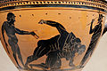Pankratiasts fighting under the eyes of a trainer and an onlooker. Side A of an Attic black-figure skyphos, ca. 500 BC. Height: 16.2 cm (6.4 in). Diameter: 22.5 cm (8.9 in).