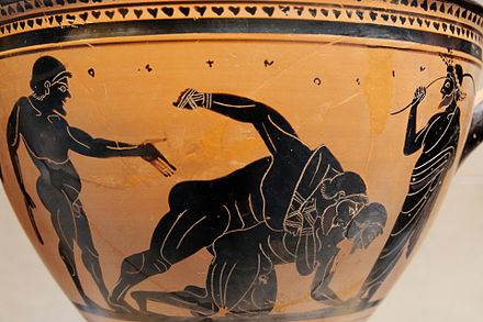Boxers (the hands are bound) fighting under the eyes of a trainer. Side A of an Attic black-figure skyphos, c. 500 BC.