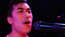 Huang performing with Hank Green and the Perfect Strangers in 2016 Perfect Strangers 2016 13 - Andrew Huang.png
