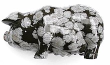 Pig carved in snowflake obsidian, 10 centimeters (4 in) long. The markings are spherulites. Pig.snowobsidian.jpg