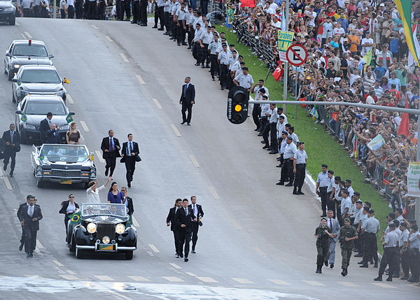 A team of bodyguards protecting Brazilian President Dilma Rousseff during her inaugural ceremony.