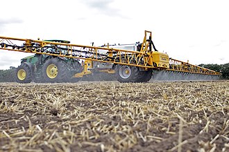 A pre-emergence spray of herbicide being added onto a field of oilseed rape. Pre-emergence spray.jpg