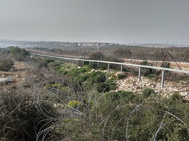 Salfit West Bank barrier and the Ariel settlement seen in the background