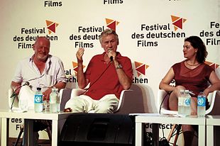 Rudolf Thome (Mitte) mit Esther Zimmering und Josef Schnelle beim Filmgespräch zu Ins Blaue, Festival des deutschen Films, 2013