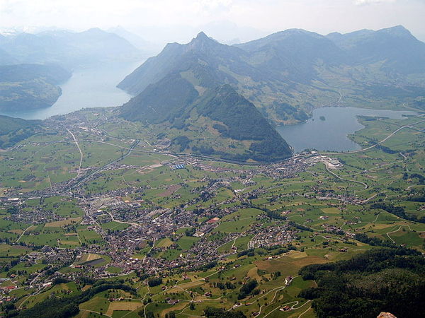 Schwyz valley, with Schwyz town in the center foreground, Mount Rigi in the right background, Lake Lucerne and Brunnen on the left and Lake Lauerz on 