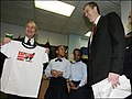 New York City Mayor Michael Bloomberg and U.S. Secretary of Education Arne Duncan enjoy the Explore Charter School T-shirt with students from the school and New York City Schools Chancellor Joel Klein. Secretary Duncan visited Explore Charter School in Brooklyn, N.Y., to discuss the importance of the American Recovery and Reinvestment Act of 2009, which provides $100 billion for education funding to save and create jobs, advance school reform and provide college grants, tuition tax credits, and school modernization funds.