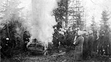 Sikhs attending a funeral outside Vancouver, c. 1914 Sikh men standing near a funeral pyre at a lumber camp in British Columbia, circa 1914 (INDOCC 1522).jpg