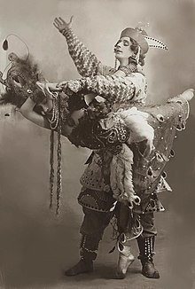 Sepia photo of Fokine dancing with Karsavina, both dressed in elaborate clothing