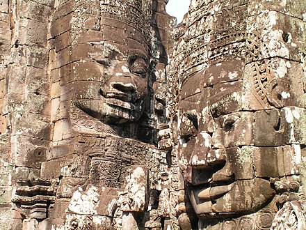 Heads of Khmer kings atop Angkor Wat Hindu-Buddhist temples of Cambodia.