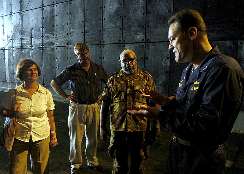 File:US Navy 070815-N-1752H-079 Capt. Ed Rhoades, commanding officer of USS Peleliu (LHA 5), explains the functions of the well deck to the Honorable Leslie V. Rowe, U.S. Ambassador to Papua New Guinea, Solomon Islands and Vanuatu,.jpg