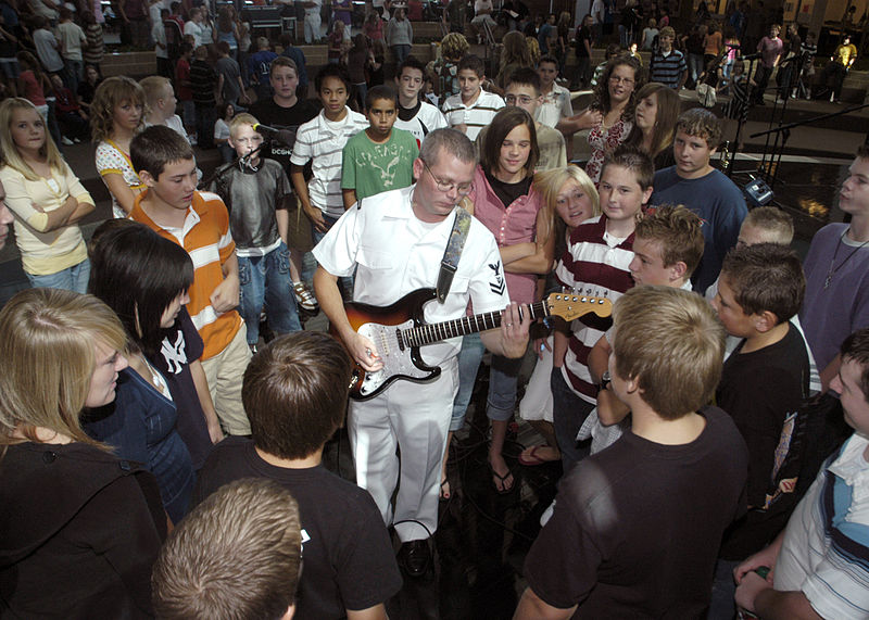 File:US Navy 070910-N-5208T-005 Musician 2nd Class Robert Collier, of U.S. Navy Band Southwest, the Destroyers, gives guitar lessons to students of West Point Junior High School.jpg