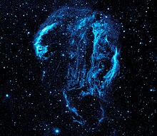 Ultraviolet view (mapped to blue visible light) of Cygnus Loop by a later ultraviolet telescope. Ultraviolet image of the Cygnus Loop Nebula crop.jpg