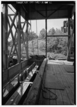 Thumbnail for File:VIEW LOOKING WEST OF INTERIOR OF SCREEN HOUSE OVER BRACKISH COOLING WATER INTAKE FLUME. PARTIALLY RAISED SCREEN IS SHOWN AT LOWER LEFT OF PHOTOGRAPH. THE REMAINS OF A COAL HAER CONN,1-GREWI,15A-12.tif