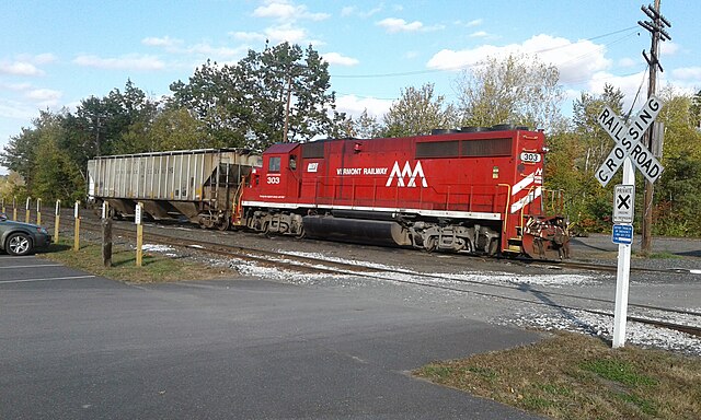 A Vermont Railway locomotive with a hopper car in White River Junction, Vermont.