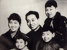 Wu (center), his wife Xin Fengxia, and their three children