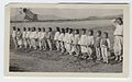 (Line of children (orphans?) with American and Korean flags) (4096133060).jpg