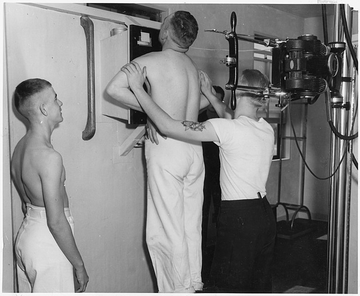 File:(Pharmacist mate conducting chest x-rays on one sailor while another sailor waits his turn at the Naval Training... - NARA - 295584.jpg