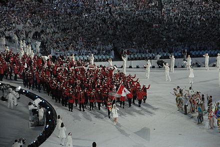 Led by flagbearer Clara Hughes, the Canadian team enters BC Place during the opening ceremonies.