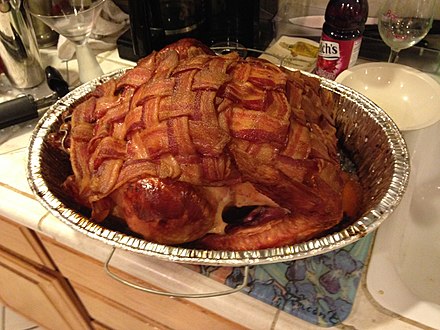 Barbecued bacon wrapped turkey